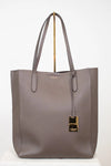 Gray tote bag with a gold clasp on a white background