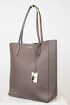 Brown tote bag with a gold tag on a white background