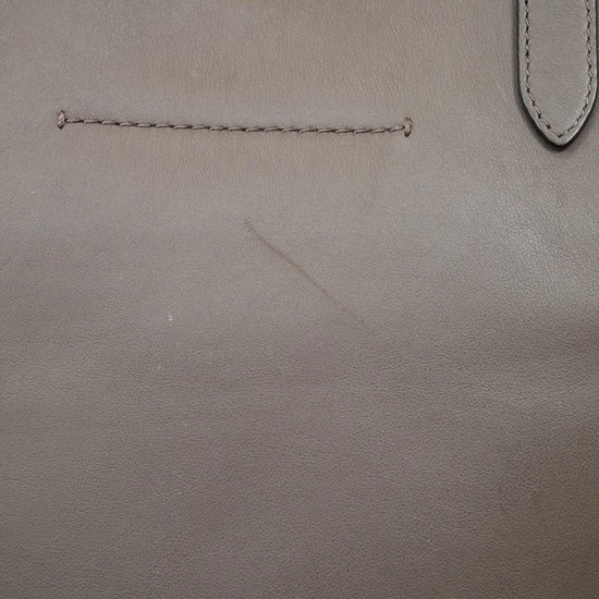 Close-up of brown leather surface with scratch detail