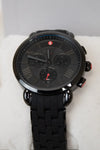 Black wristwatch with detailed face on a white cushion