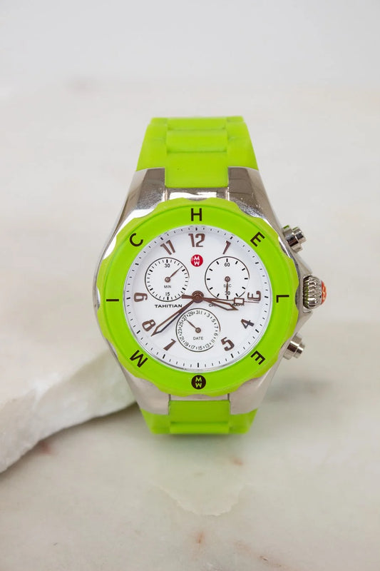 Green watch with a white face on a light background