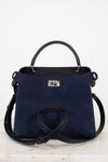 Navy blue handbag with silver-tone accents on a light gray background
