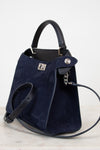 Navy blue handbag with silver-tone accents on a light gray background