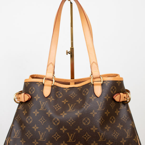 Designer handbag with monogram pattern on a light background