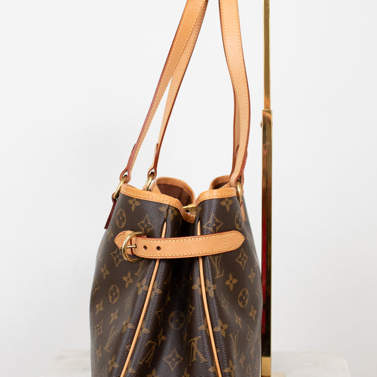 Designer handbag with monogram pattern on a white background