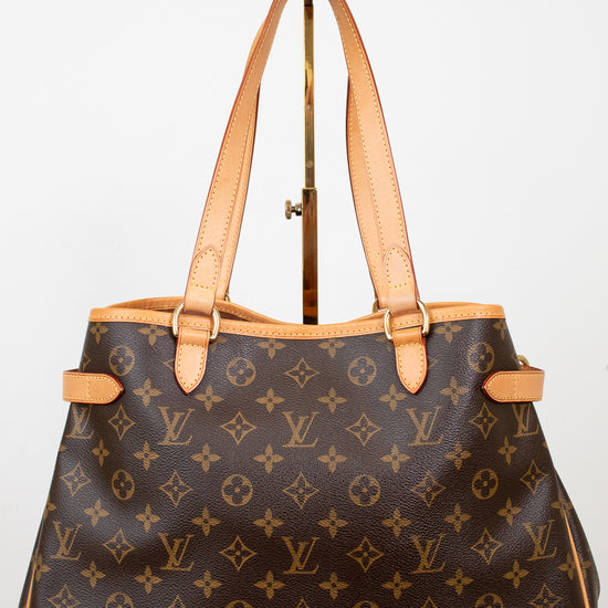 Designer handbag with monogram pattern on a white background