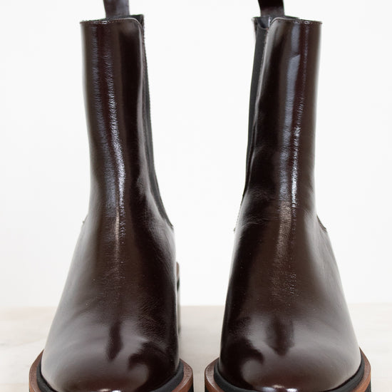 Pair of brown leather boots on a white background