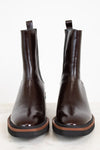Pair of brown leather boots on a white background