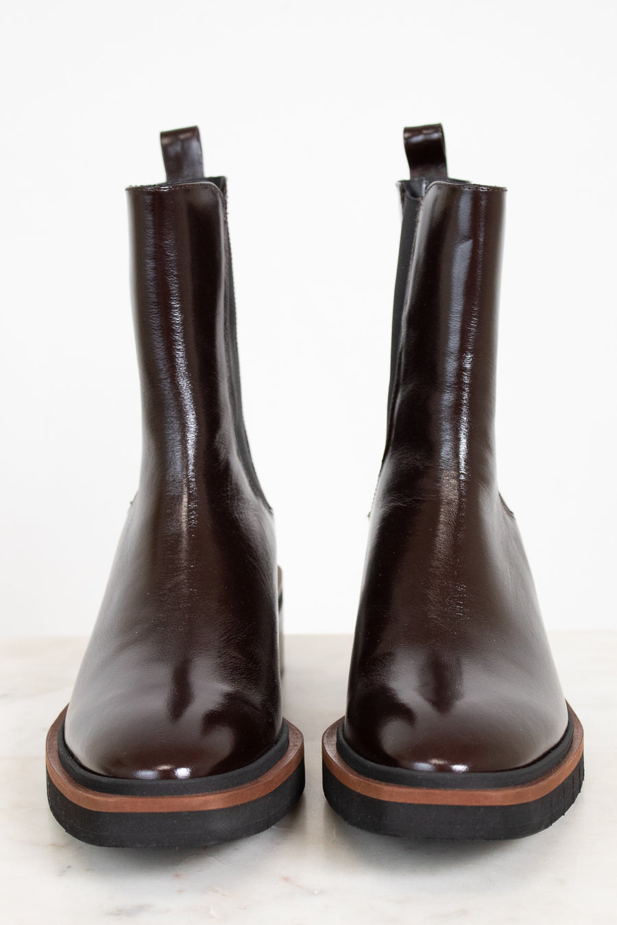 Pair of brown leather boots on a white background