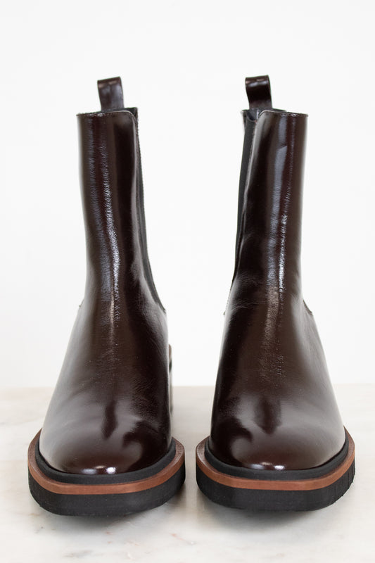 Pair of brown leather boots on a white background