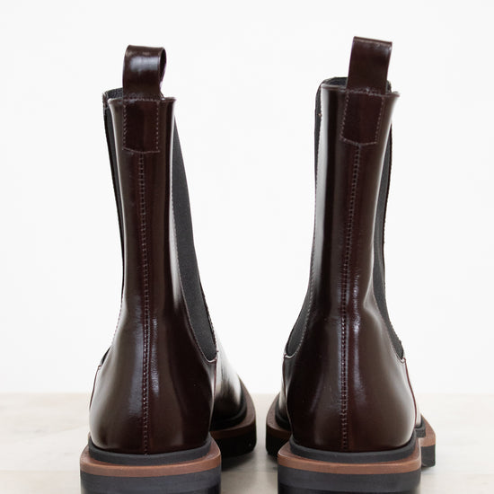 Pair of brown leather boots on a white background