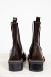 Pair of brown leather boots on a white background