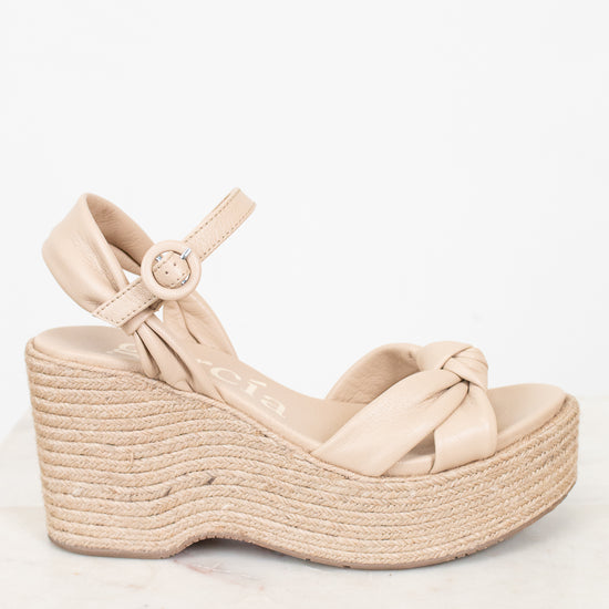 Beige wedge sandal with espadrille sole on a white background