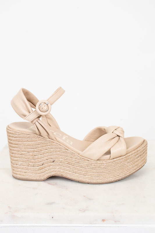 Beige wedge sandal with espadrille sole on a white background
