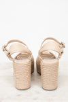 Beige sandals with woven sole on a white background