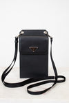 Black crossbody bag with Prada logo on a white background