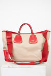 Red and beige handbag on a white background