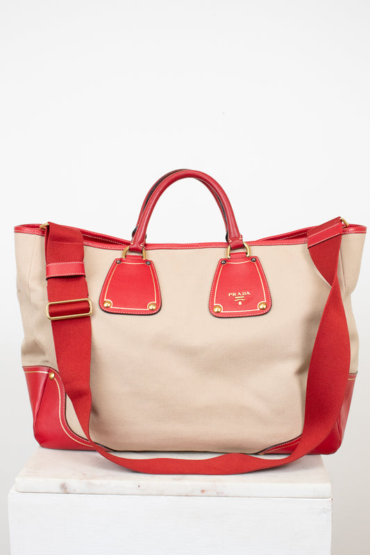 Red and beige handbag on a white background