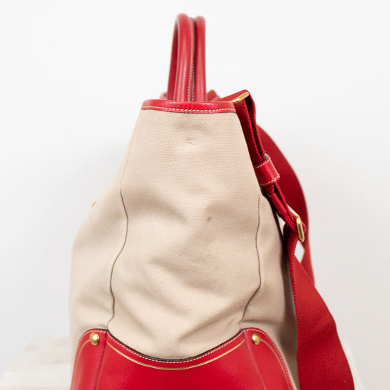 Red and beige handbag on a white background