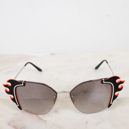 Sunglasses with flame details on a light background