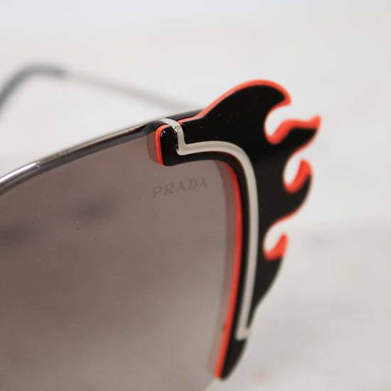 Sunglasses with flame-like ends on a white background