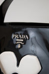 Close-up of a Prada handbag with a blurred background