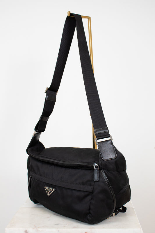 Black Prada shoulder bag on a white background