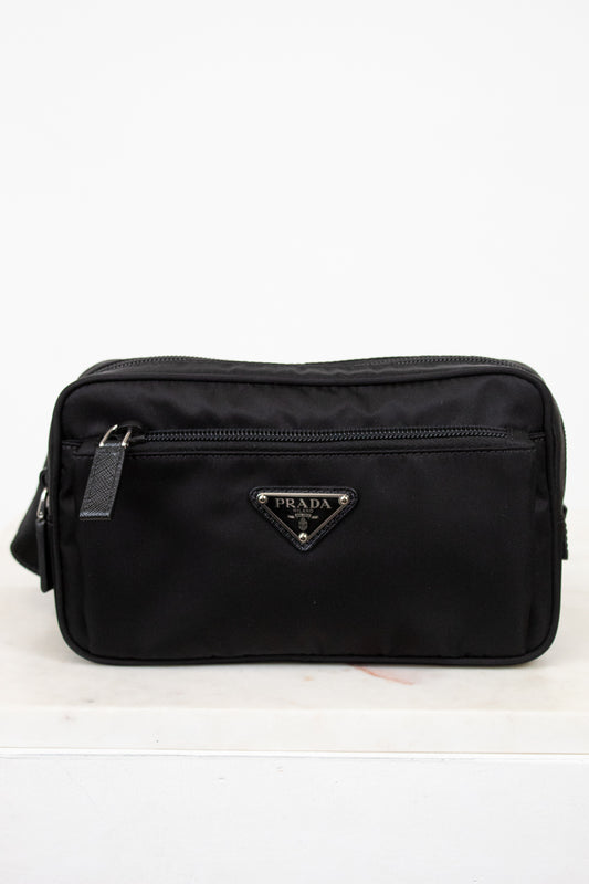 Black Prada bag on a white background