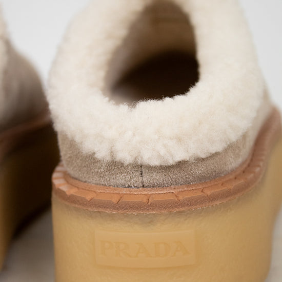Close-up of a Prada shoe with white shearling lining and gum sole.