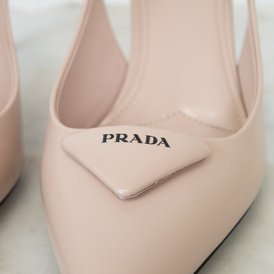 nude/pink Prada heeled shoes on a light background
