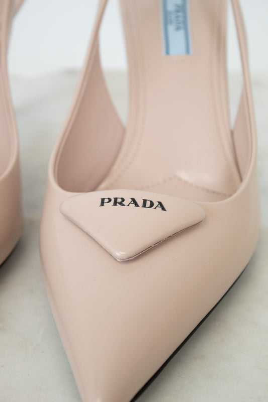 nude/pink Prada heeled shoes on a light background