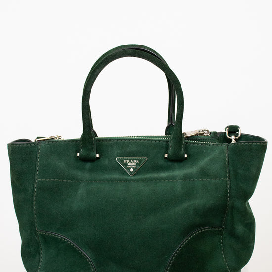 Green handbag on a white background