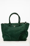 Green handbag on a white background
