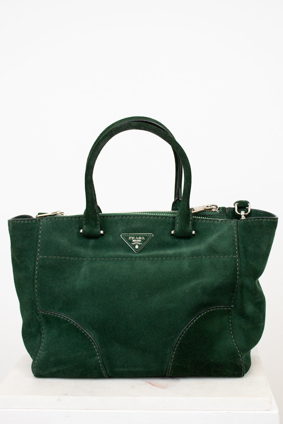 Green handbag on a white background