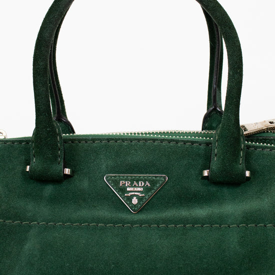 Green Prada handbag with a clear background