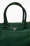 Green Prada handbag with a clear background