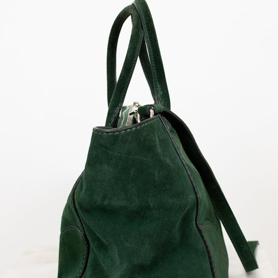 Green backpack on a white background