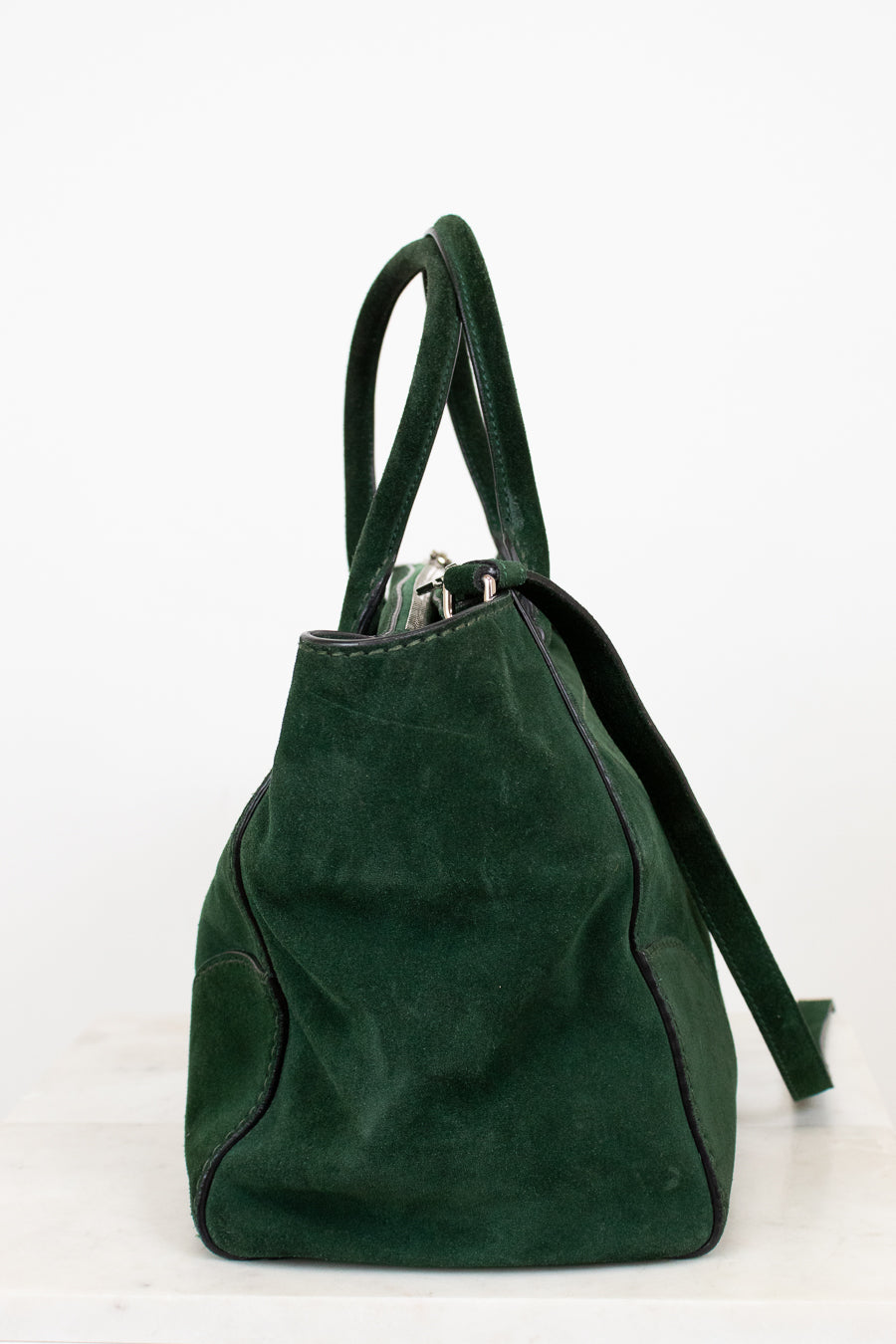 Green backpack on a white background