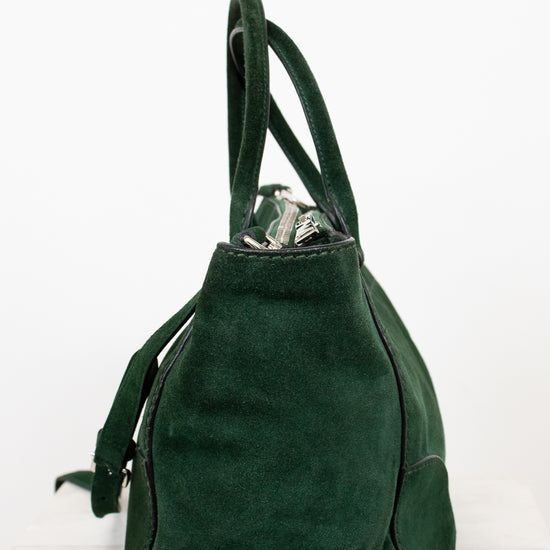 Green handbag on a white background