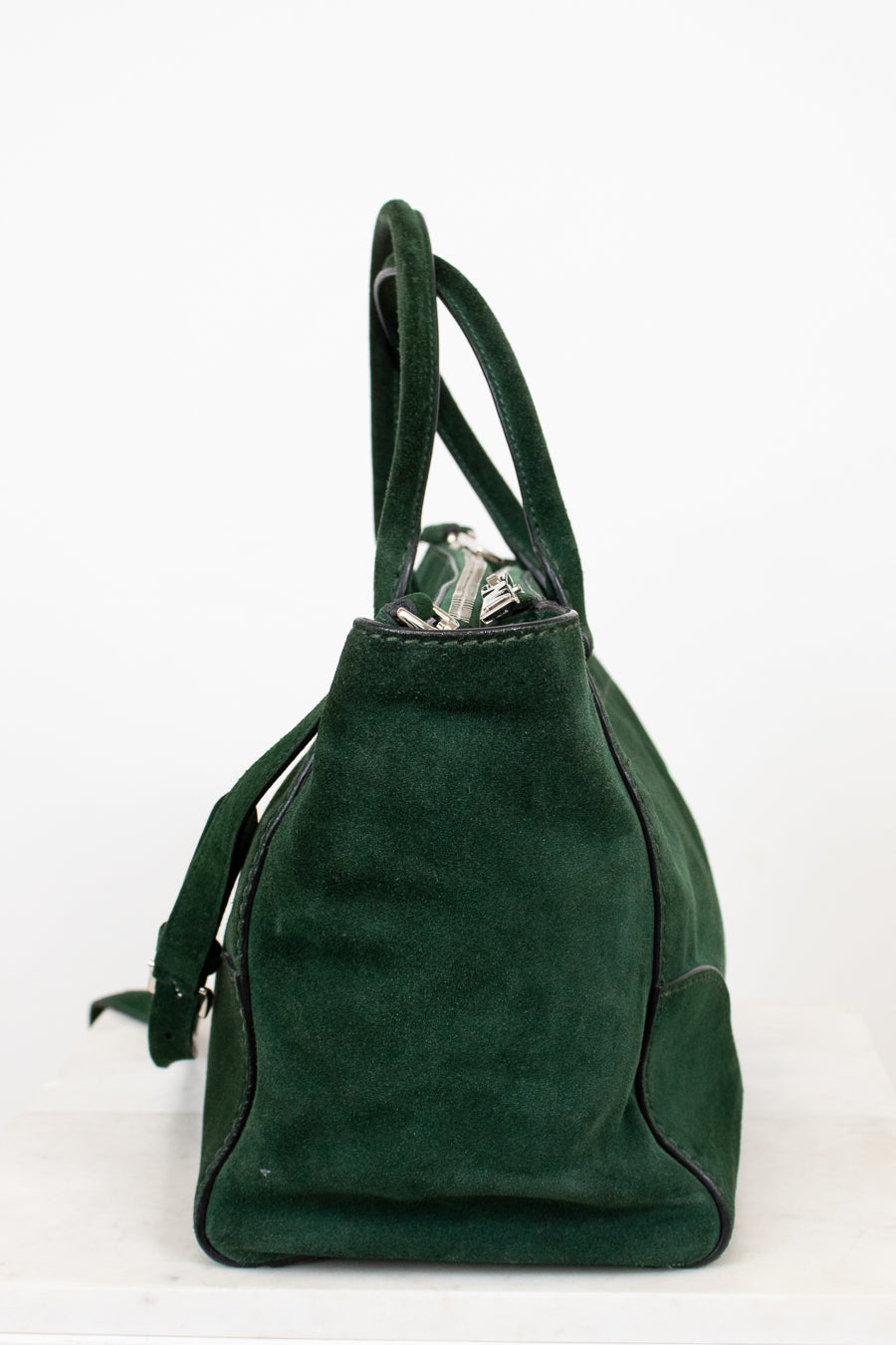 Green handbag on a white background