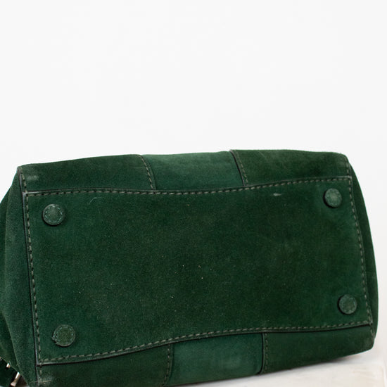 Green leather bag on a white background