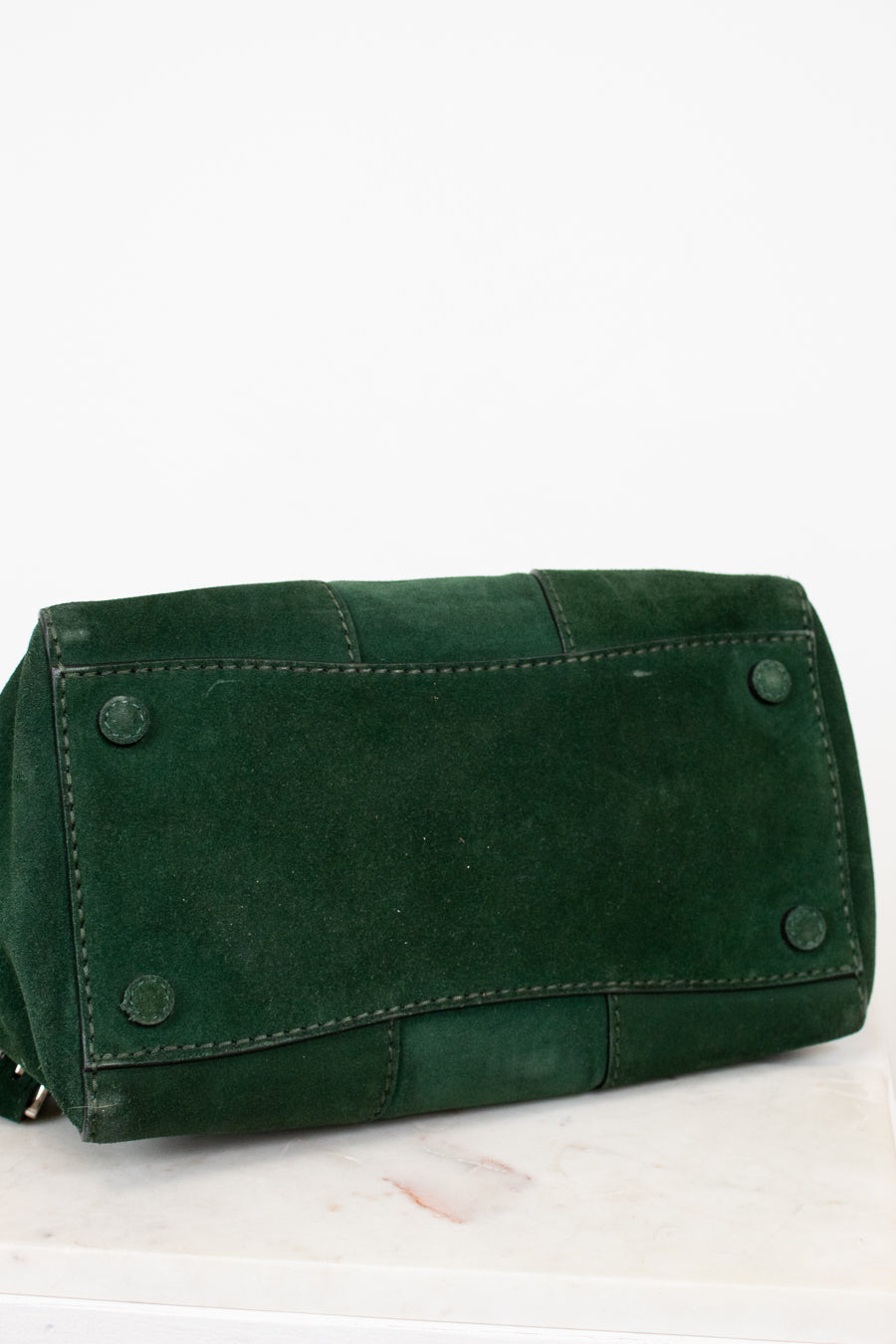 Green leather bag on a white background