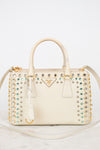 Decorative handbag with embellishments on a white background