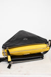 Black and yellow handbag with Prada logo on a white background