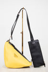Yellow and black shoulder bag with a visible brand logo on a white background