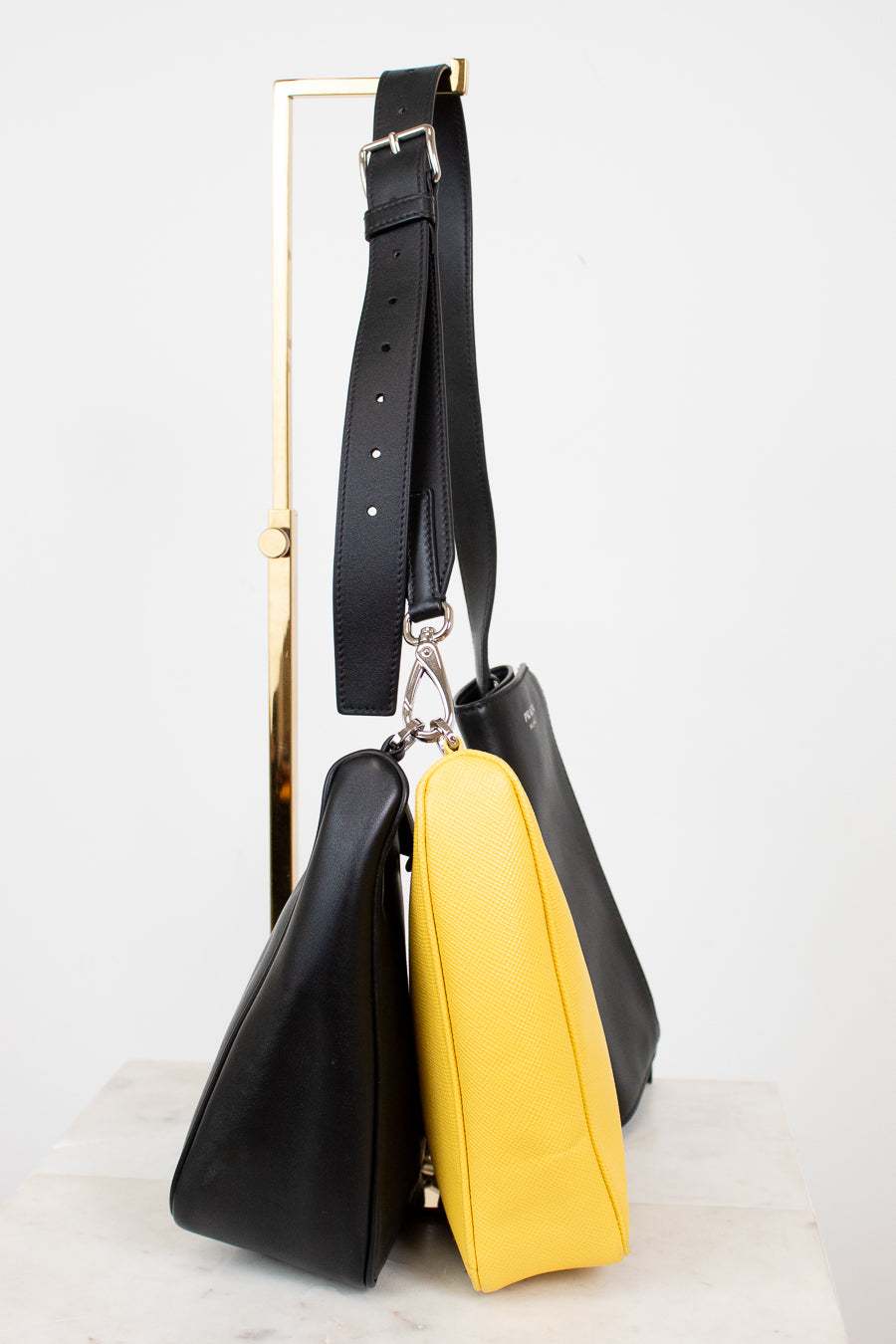 Black and yellow handbag on a white background