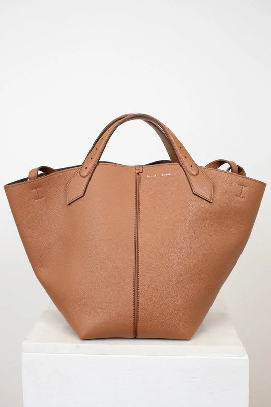 Brown leather tote bag on a white background