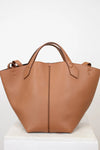 Brown leather tote bag on a white background