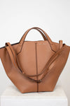Brown leather handbag on a white background