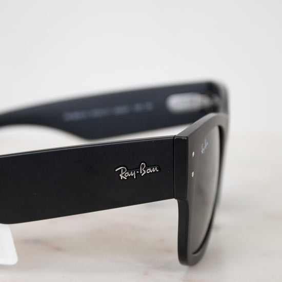 Black Ray-Ban sunglasses on a marble surface